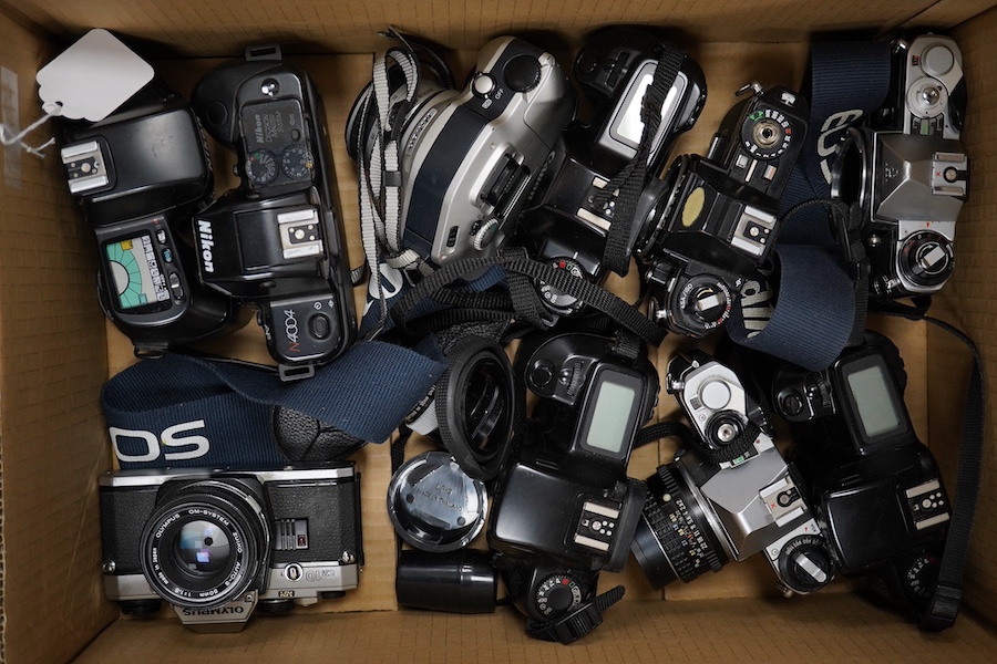 Ten SLR camera bodies by Nikon, Olympus, Canon, Pentax, etc., together with twelve lenses by Nikon, Minolta, Tamron, Vivitar etc. and other accessories including a selection of camera flash lights, etc. Condition - poor